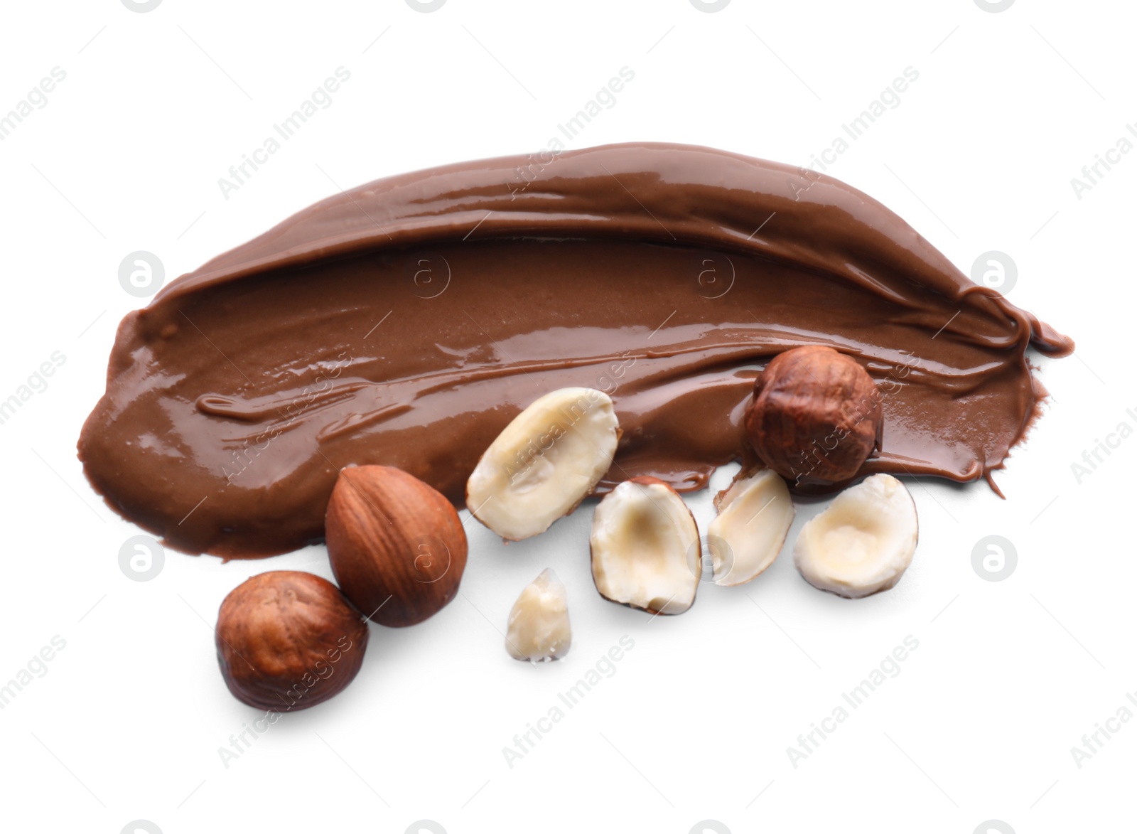 Photo of Delicious chocolate paste with hazelnuts on white background, top view