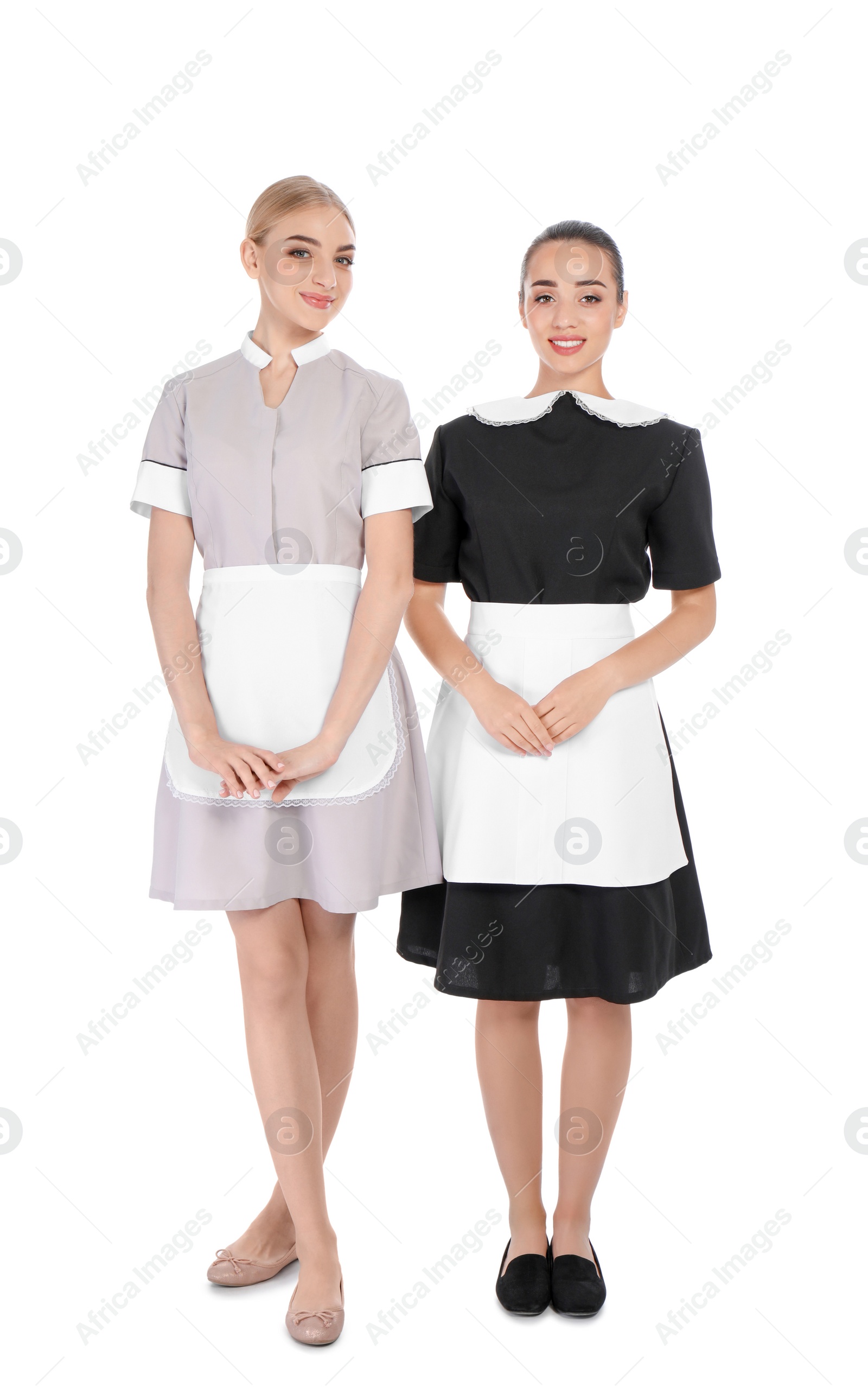 Photo of Full length portrait of young chambermaids on white background