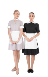 Full length portrait of young chambermaids on white background