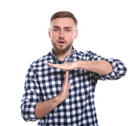 Man showing TIME OUT gesture in sign language on white background