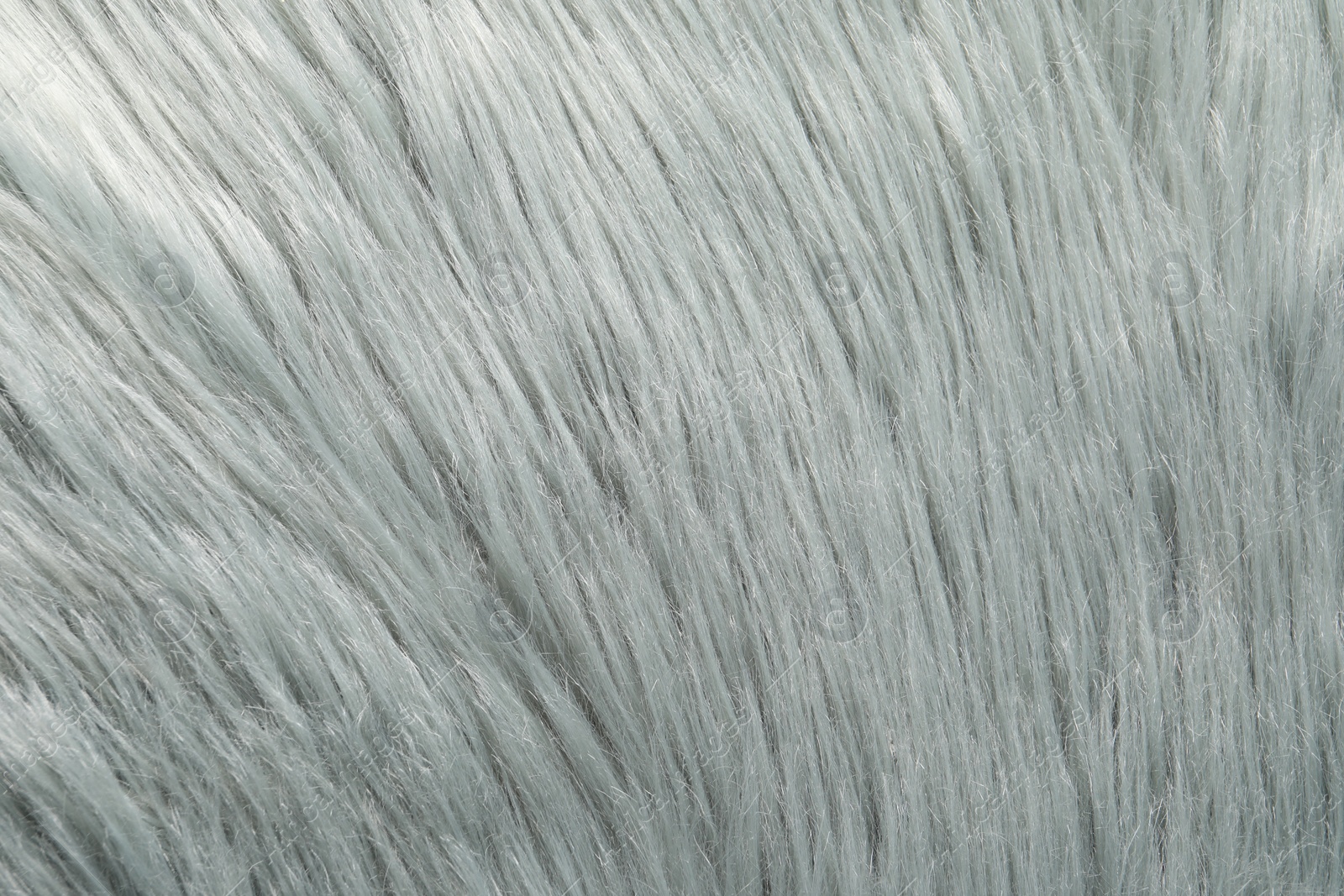 Photo of Texture of grey faux fur as background, closeup
