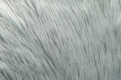 Texture of grey faux fur as background, closeup