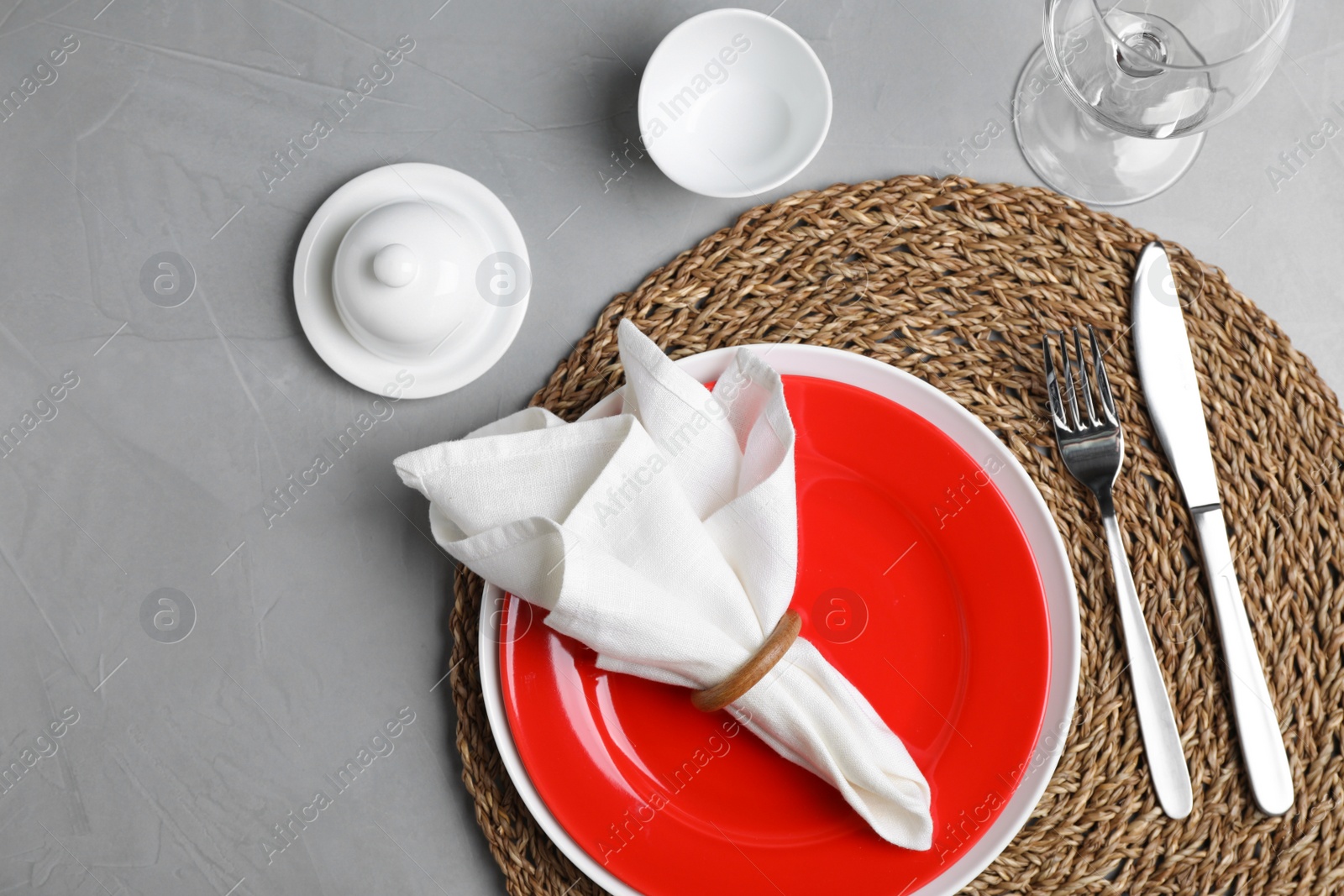 Photo of Elegant table setting on grey stone surface, top view
