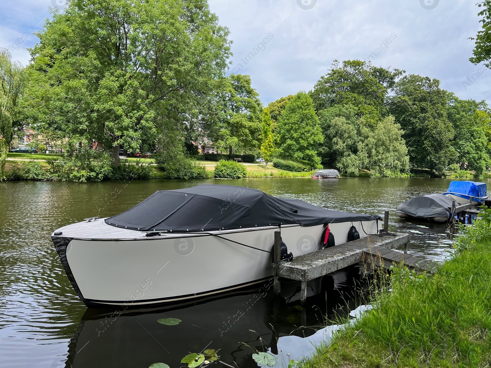 Photo of Beautiful view of canal with moored boats on sunny day