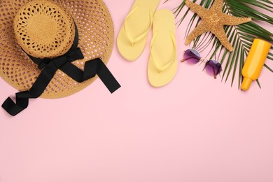 Photo of Flat lay composition with beach objects on pink background, space for text