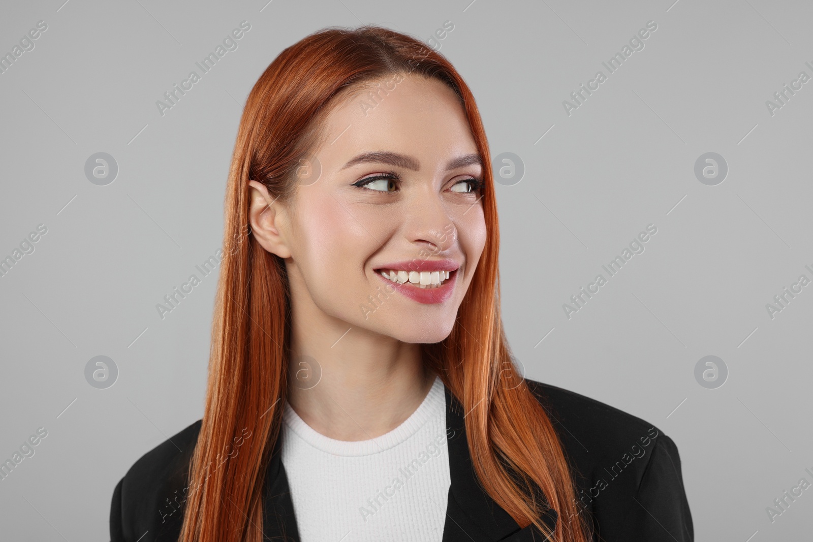 Photo of Portrait of beautiful young woman on light gray background