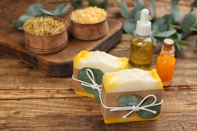 Photo of Natural handmade soap bars on wooden table