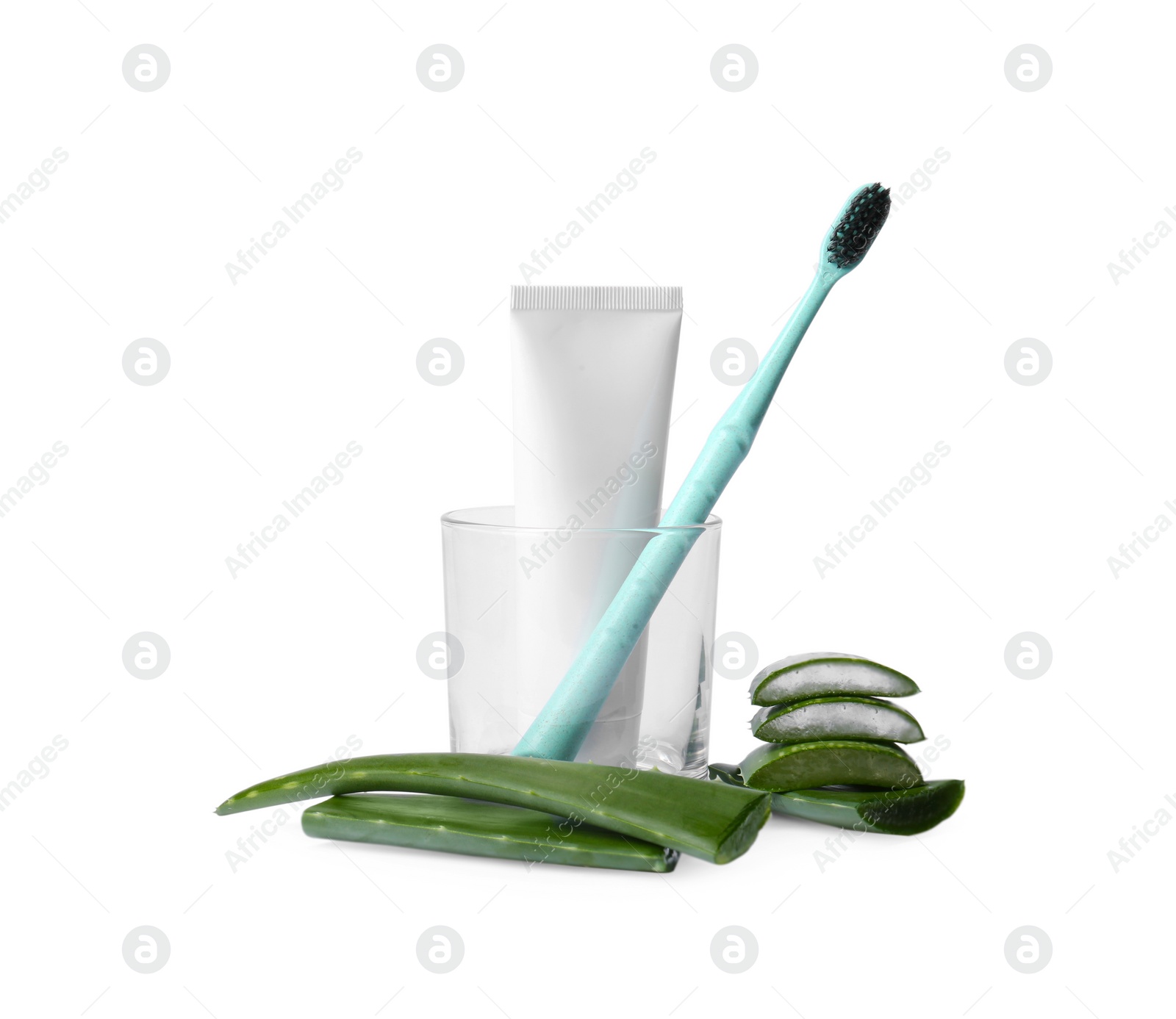 Photo of Aloe vera toothpaste in blank tube, green leaves and brush isolated on white