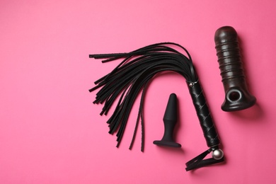 Set of different sex toys on pink background, flat lay. Space for text