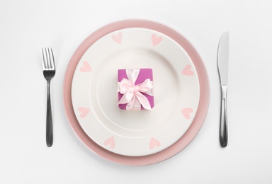 Beautiful table setting on white background, flat lay. Valentine's Day dinner