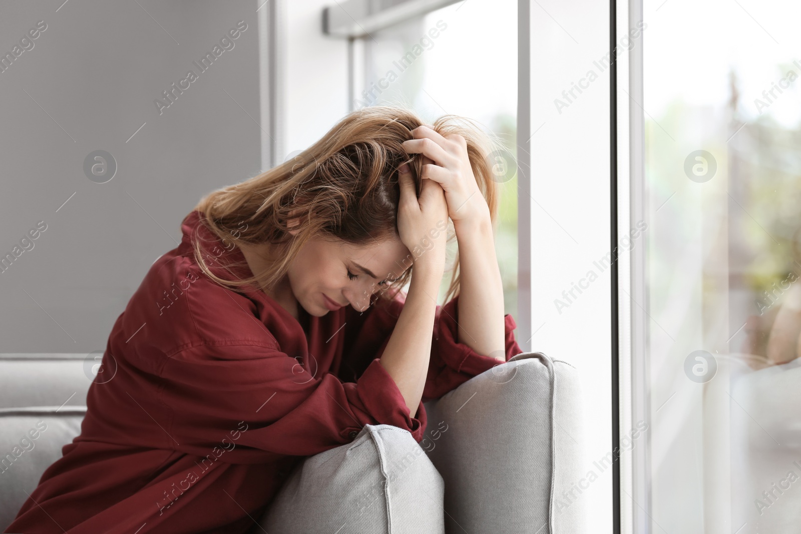 Photo of Lonely woman suffering from depression at home
