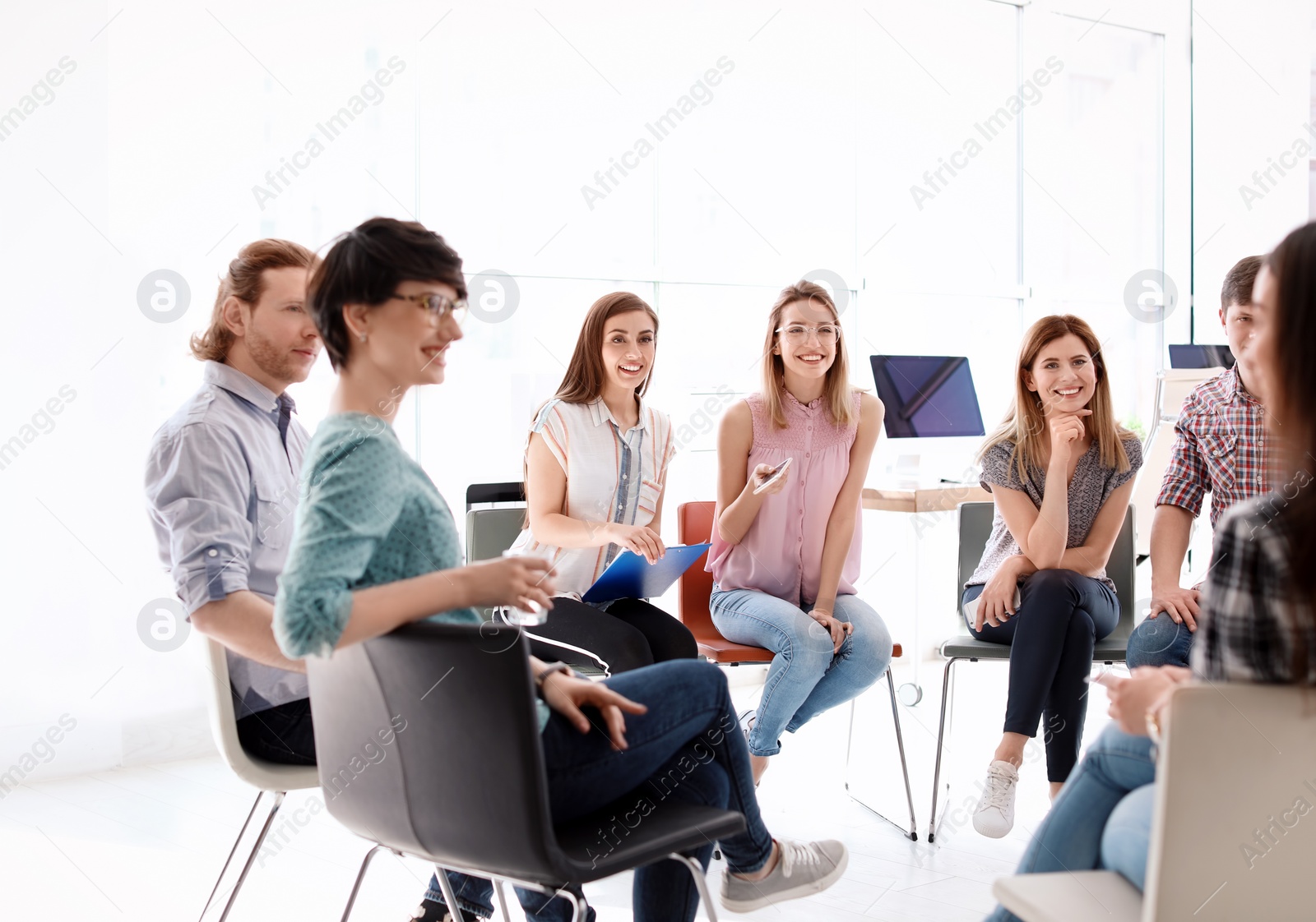 Photo of Young people having business training in office