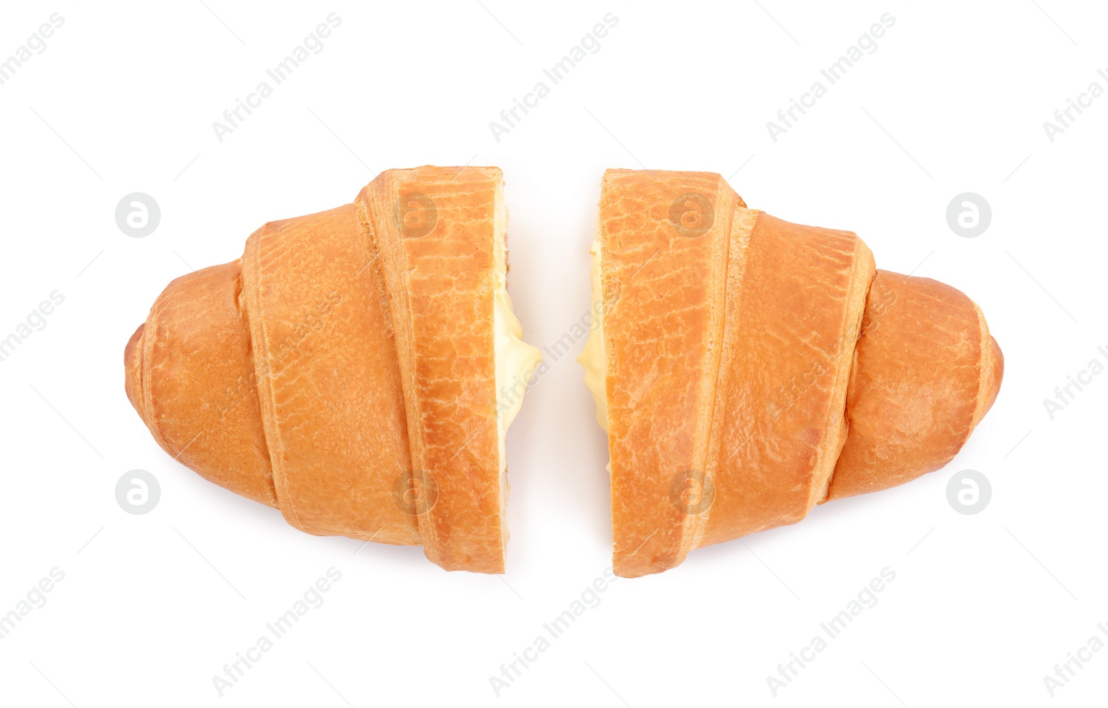 Photo of Halves of delicious croissant with cream on white background, top view