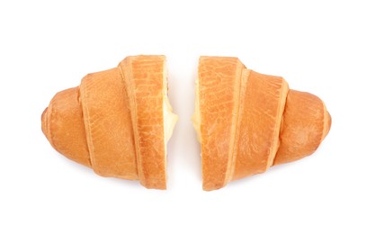 Photo of Halves of delicious croissant with cream on white background, top view