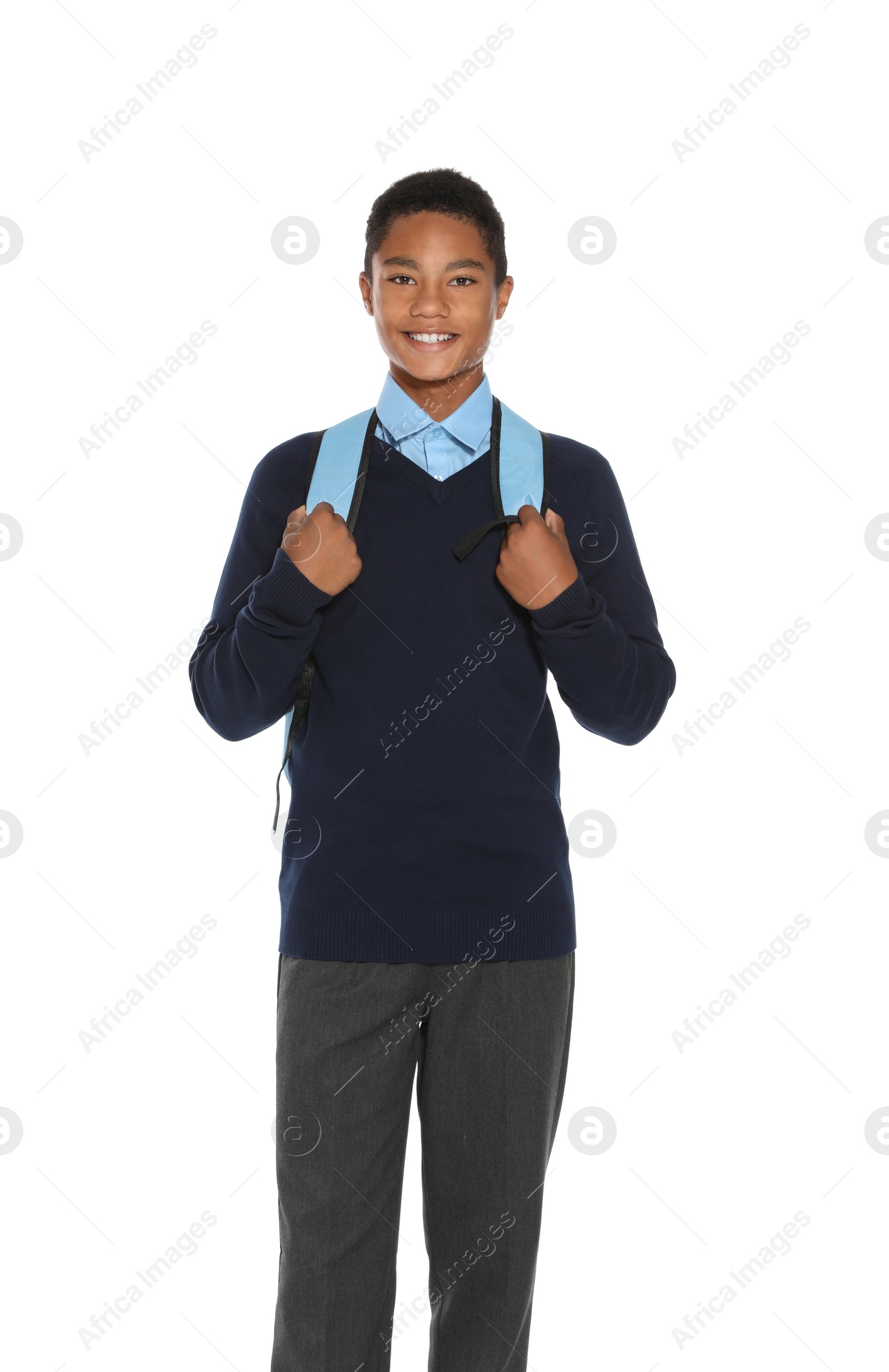 Photo of African American teenage boy in stylish school uniform on white background