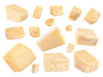 Image of Set with pieces of delicious parmesan cheese on white background 