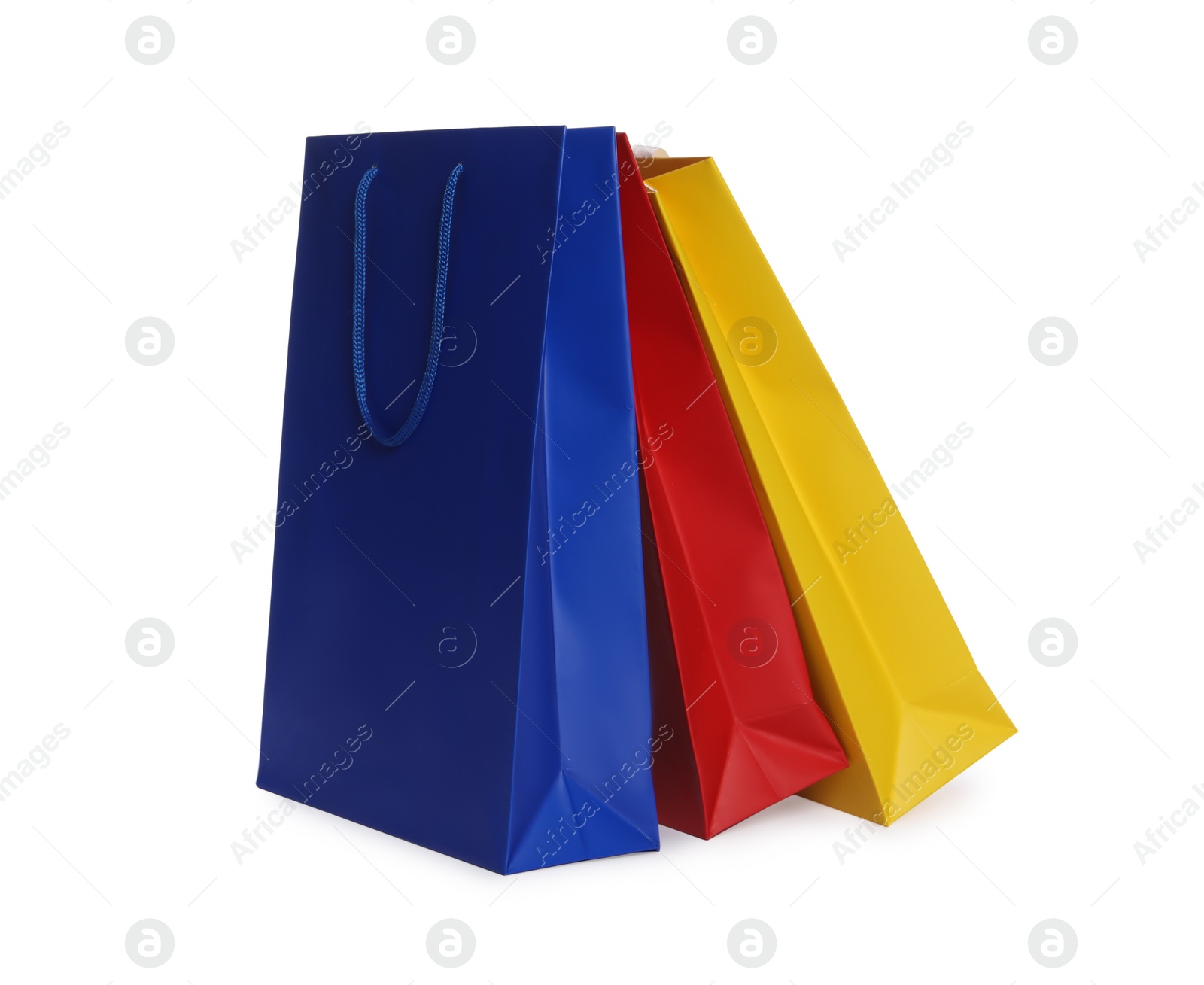 Photo of Colorful paper shopping bags isolated on white