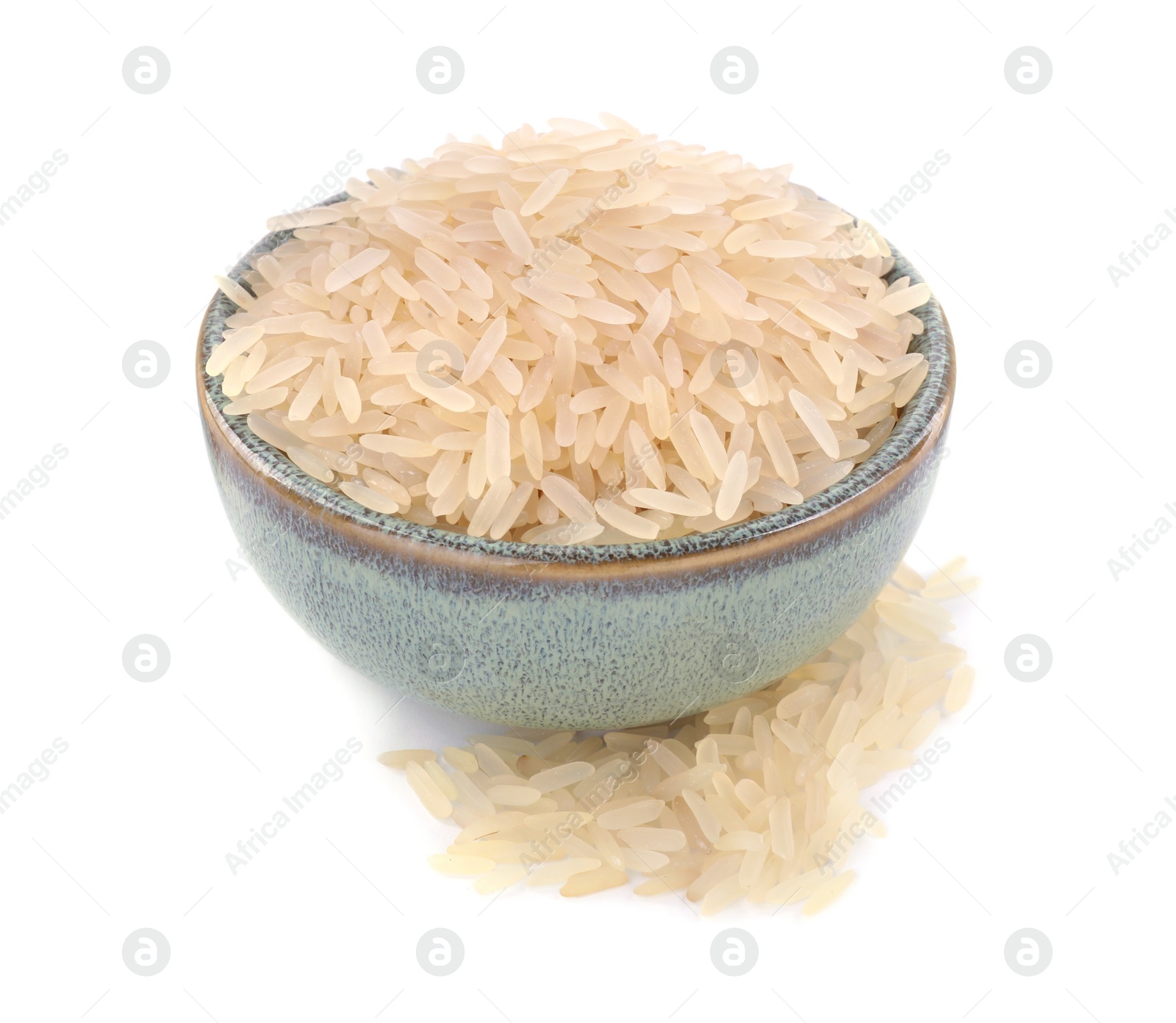 Photo of Raw rice in bowl isolated on white