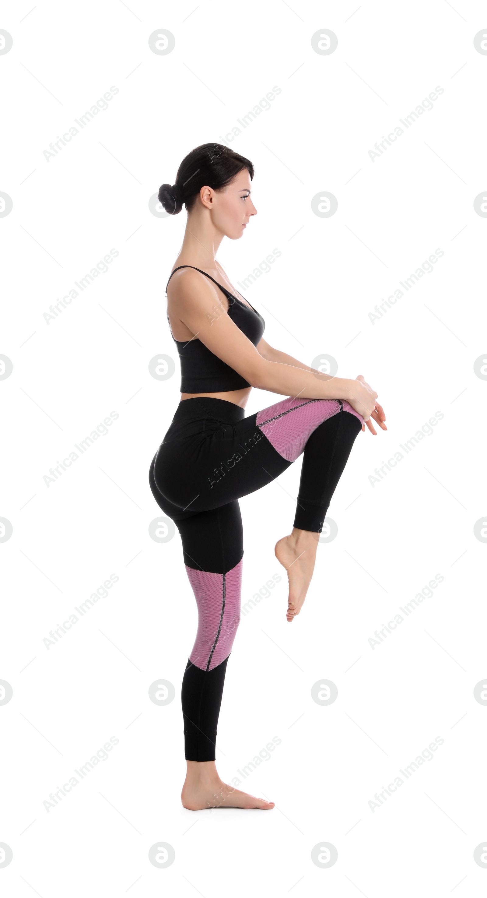 Photo of Professional young acrobat exercising on white background