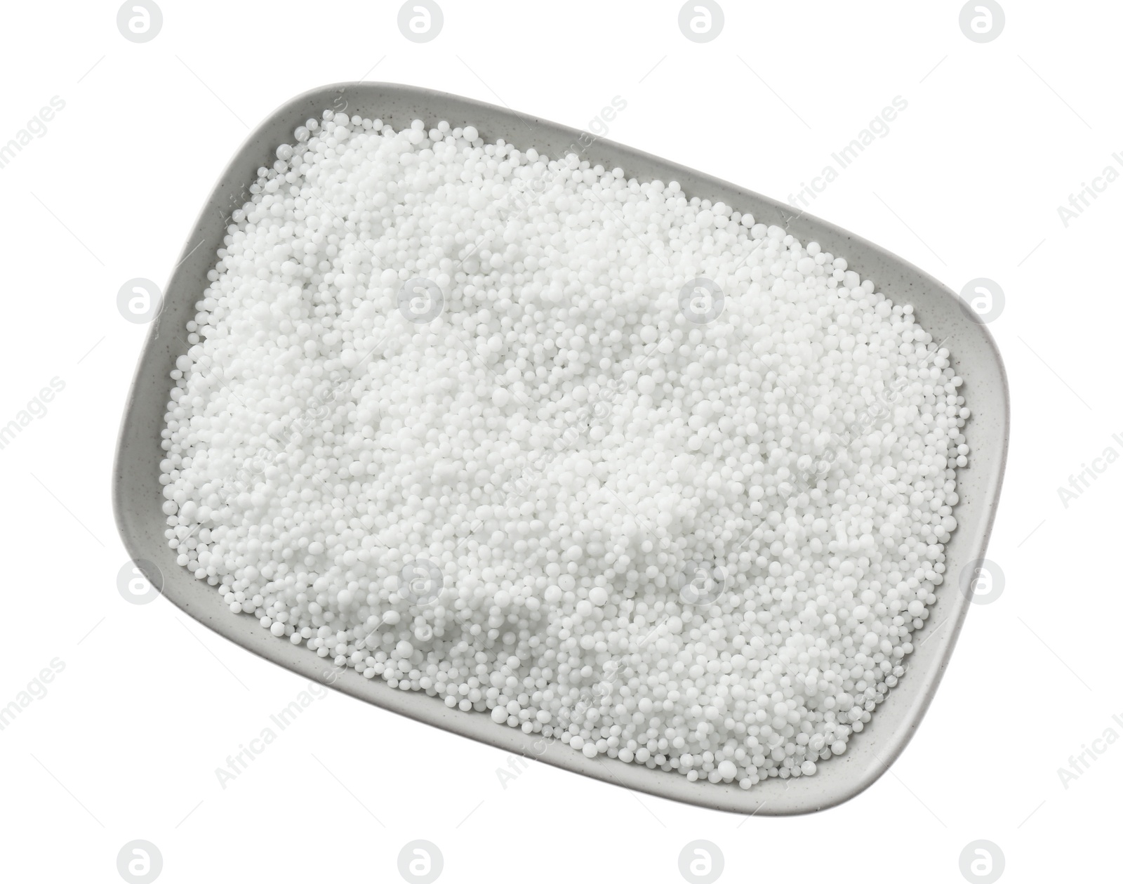 Photo of Pellets of ammonium nitrate isolated on white, top view. Mineral fertilizer