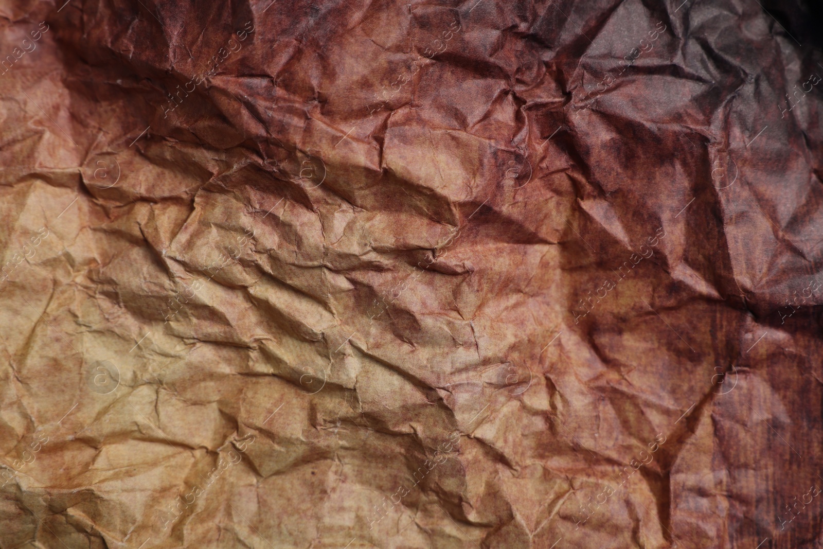 Photo of Texture of crumpled parchment paper as background, top view