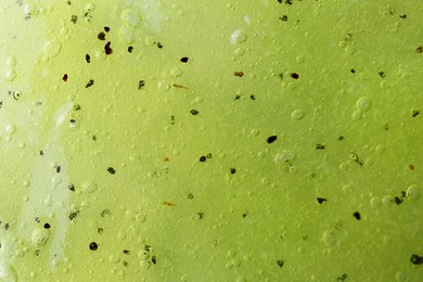 Photo of Texture of yellow shower gel as background, closeup