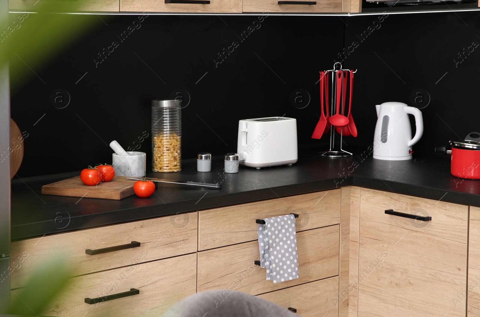 Photo of Kitchen interior with new furniture, appliances and houseware