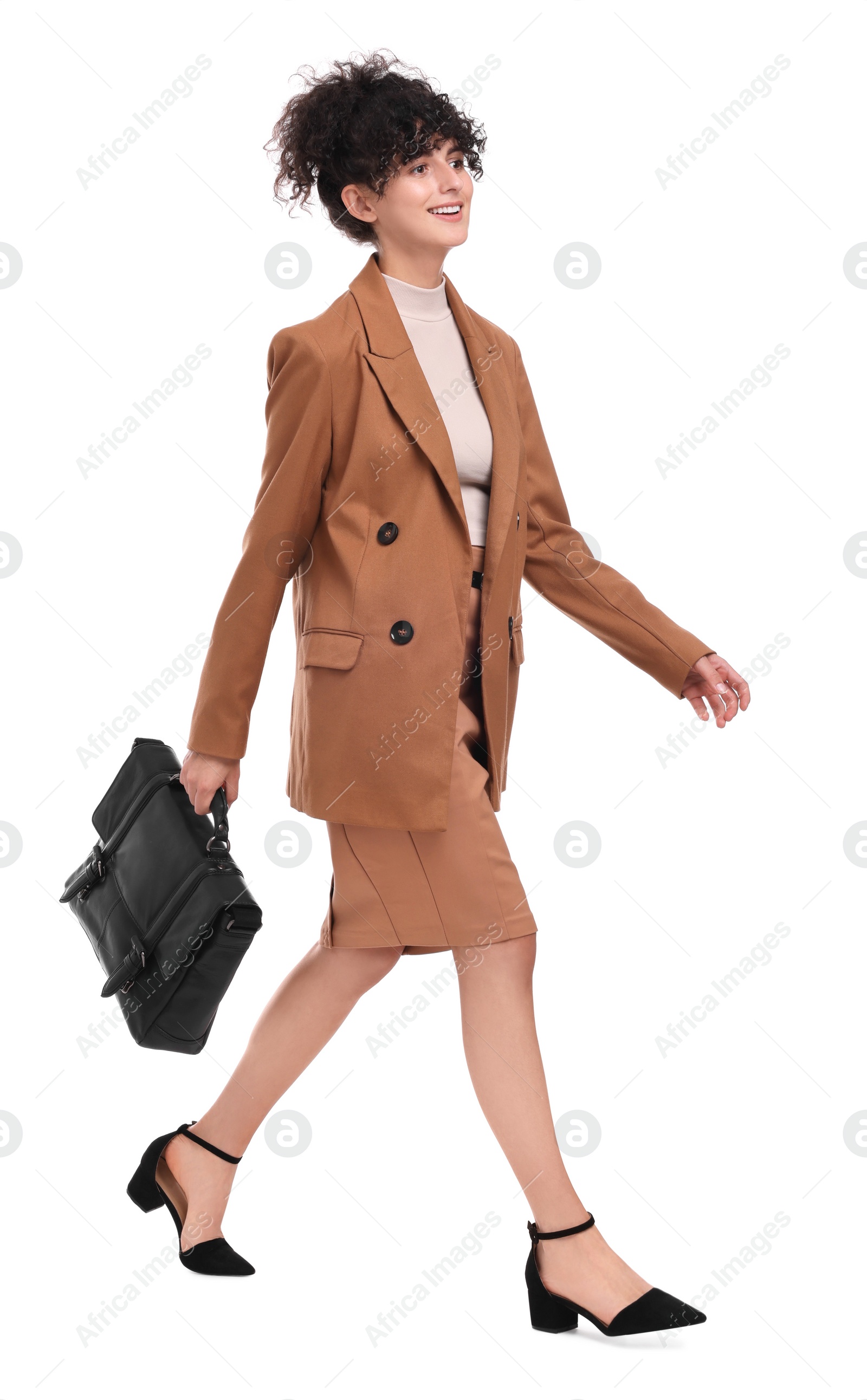 Photo of Beautiful businesswoman in suit with briefcase walking on white background