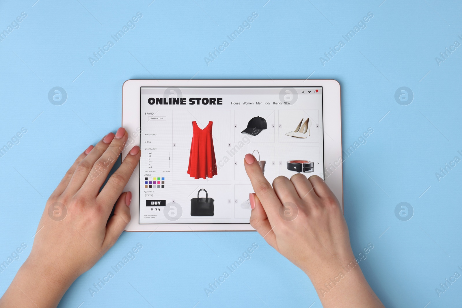 Photo of Woman with tablet shopping online on light blue background, top view