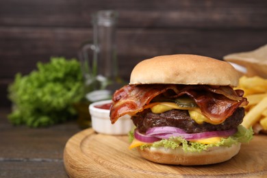 Photo of Tasty burger with bacon, vegetables and patty on wooden table, closeup. Space for text