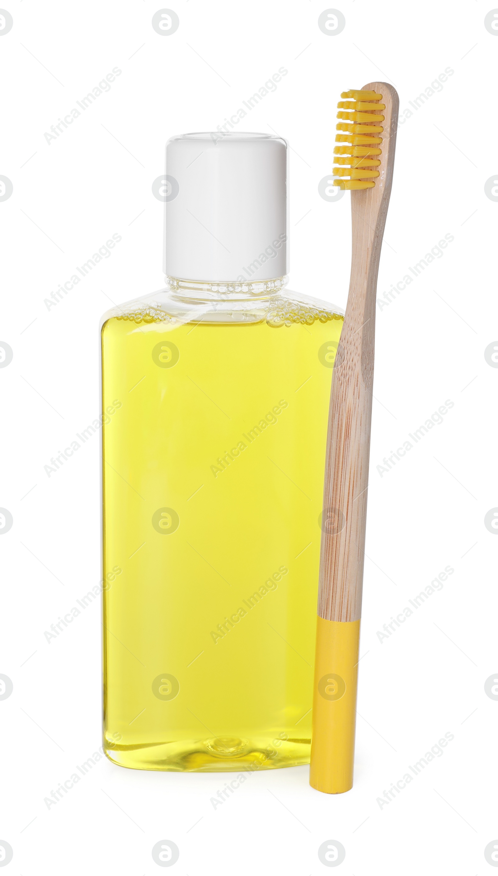 Photo of Bottle of mouthwash and toothbrush isolated on white