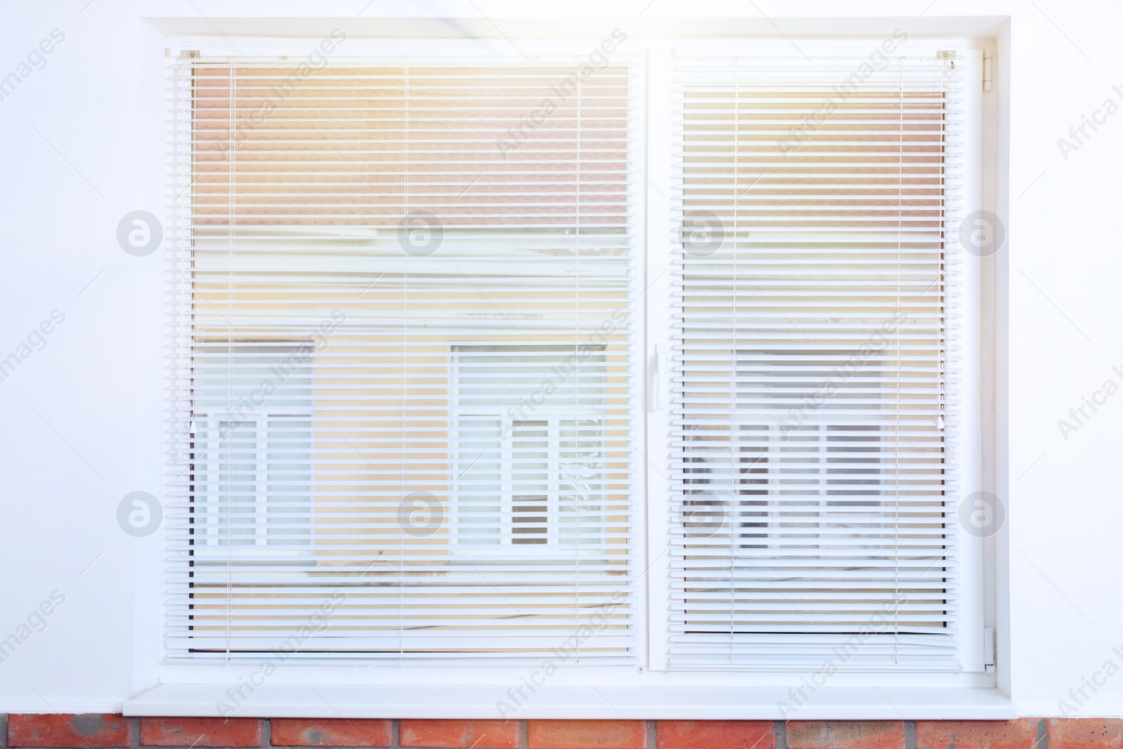 Photo of Modern window with blinds in empty room