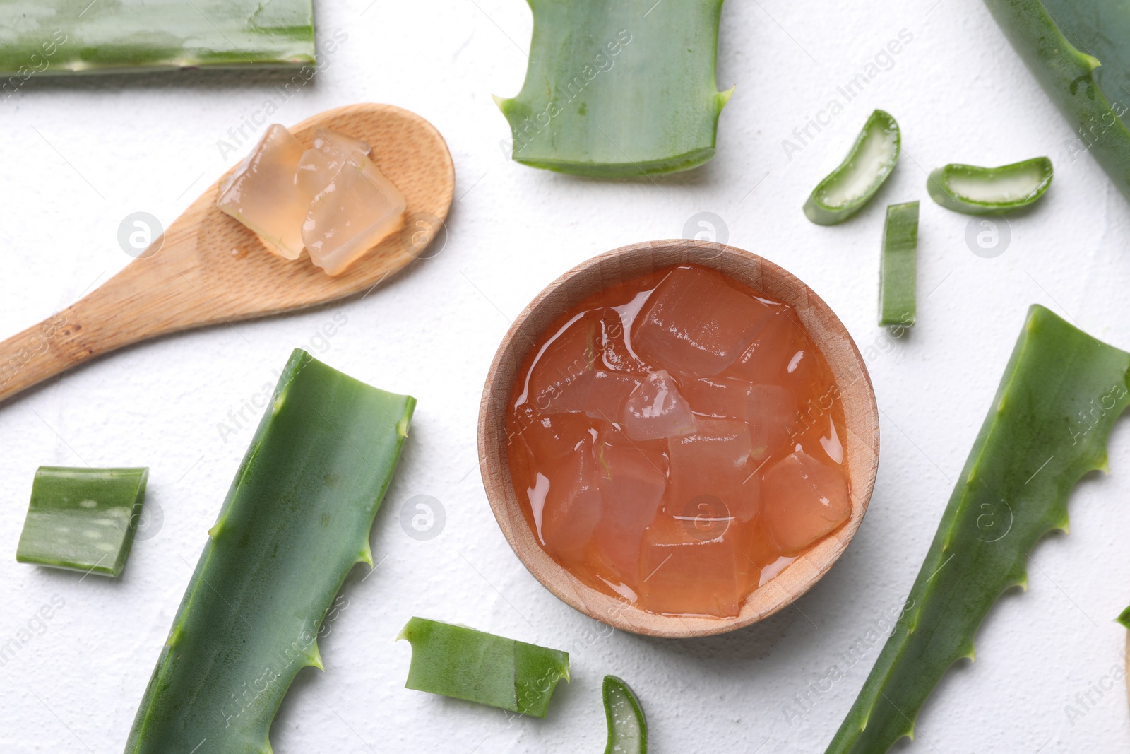 Photo of Flat lay composition with aloe vera gel and slices of plant on white background