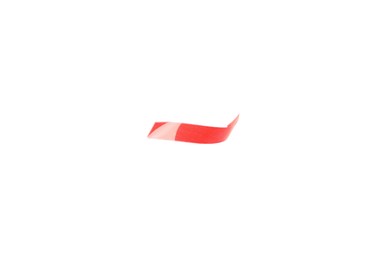 Piece of red confetti isolated on white