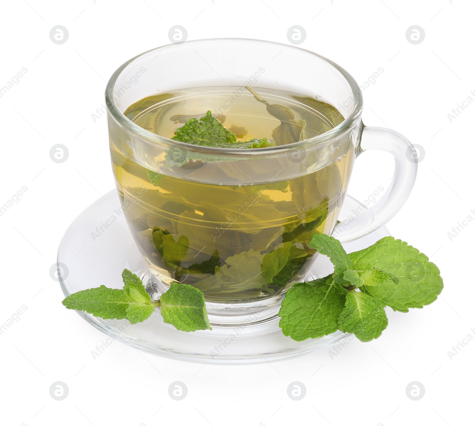 Photo of Fresh green tea in glass cup, mint and saucer isolated on white