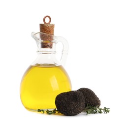 Photo of Glass jug of oil, fresh truffles and thyme on white background
