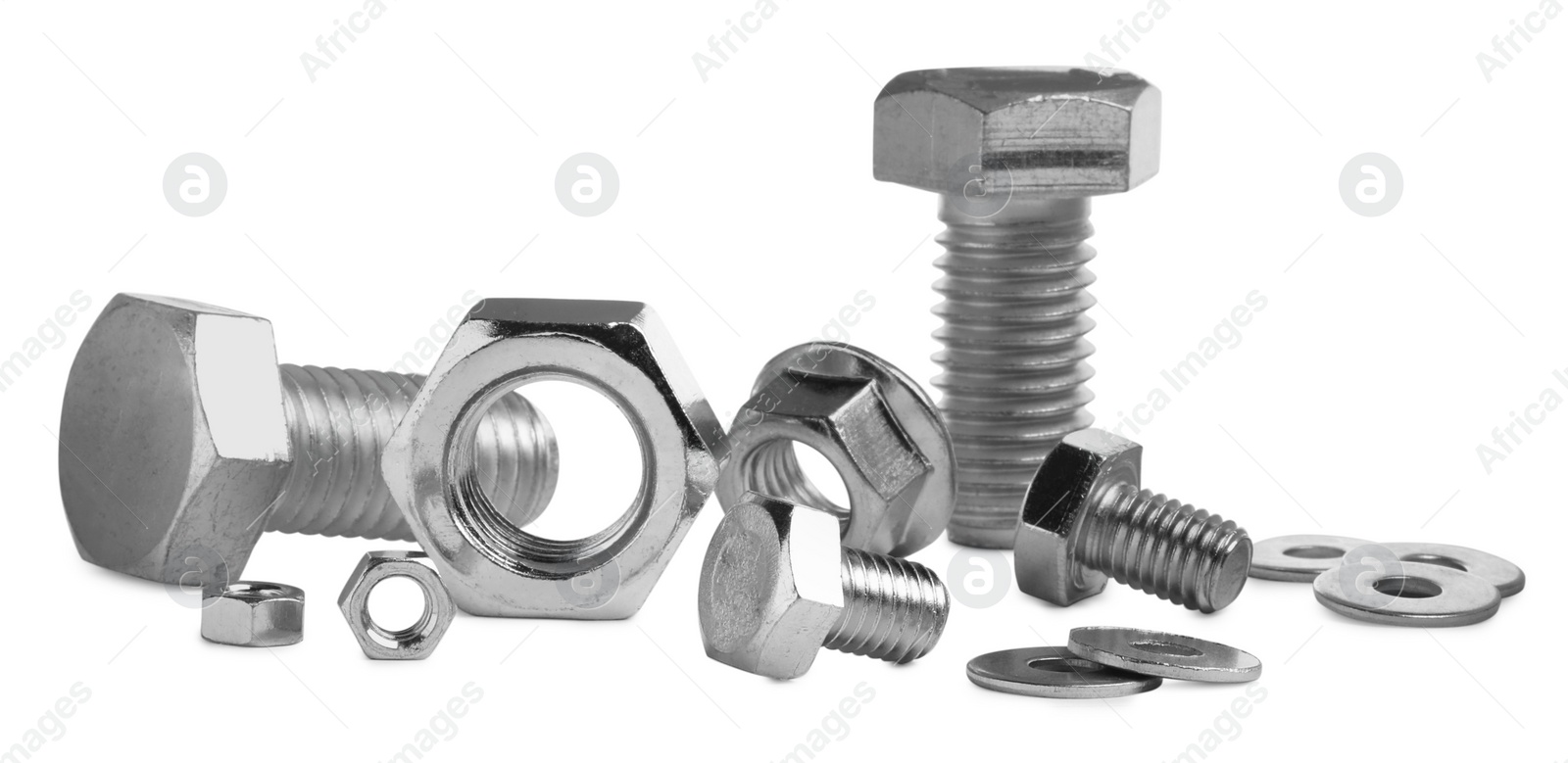 Photo of Different metal bolts and nuts on white background