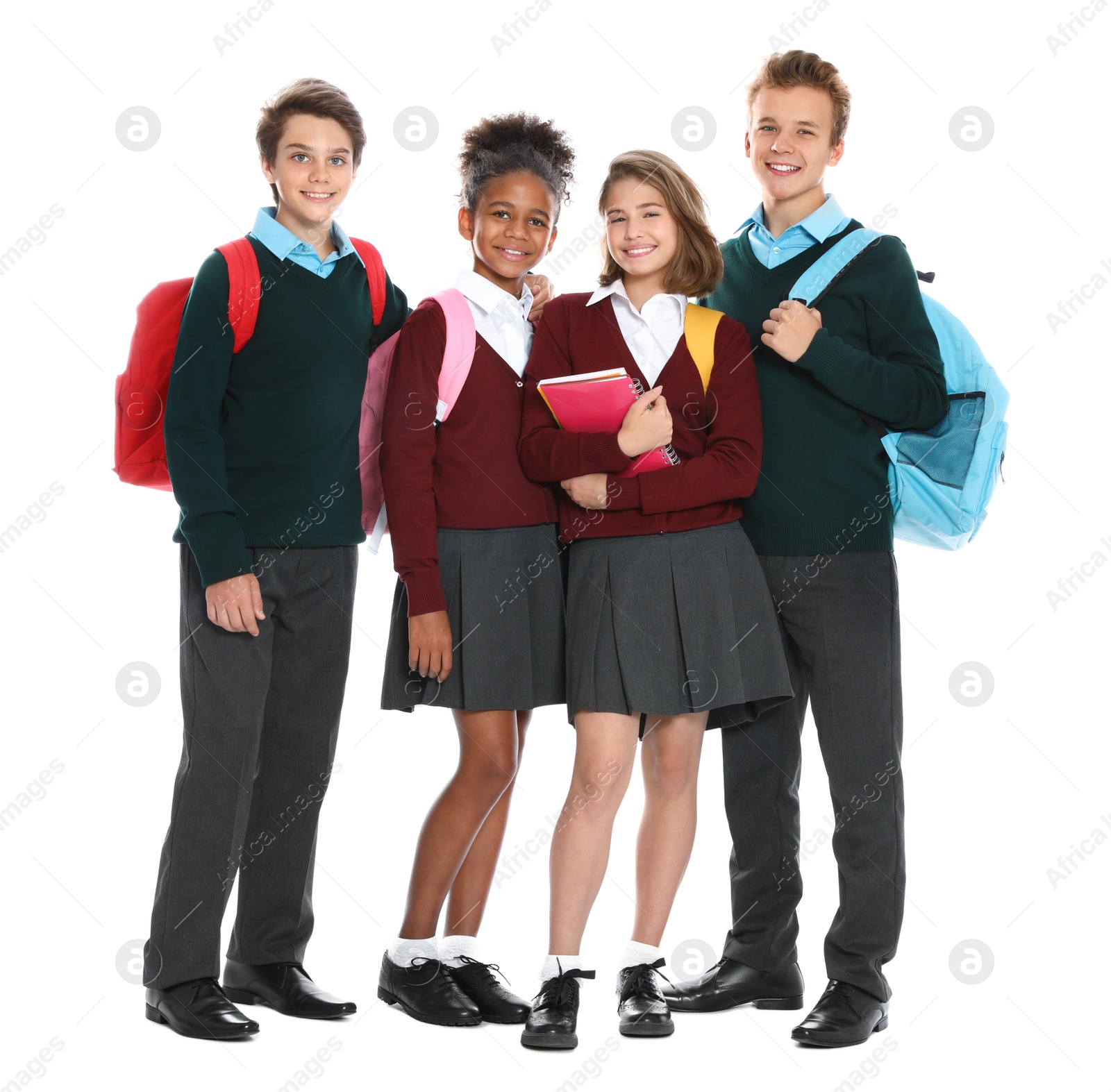 Photo of Happy pupils in school uniform on white background