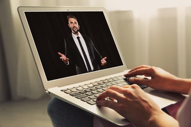 Image of Woman watching performance of motivational speaker on laptop indoors, closeup