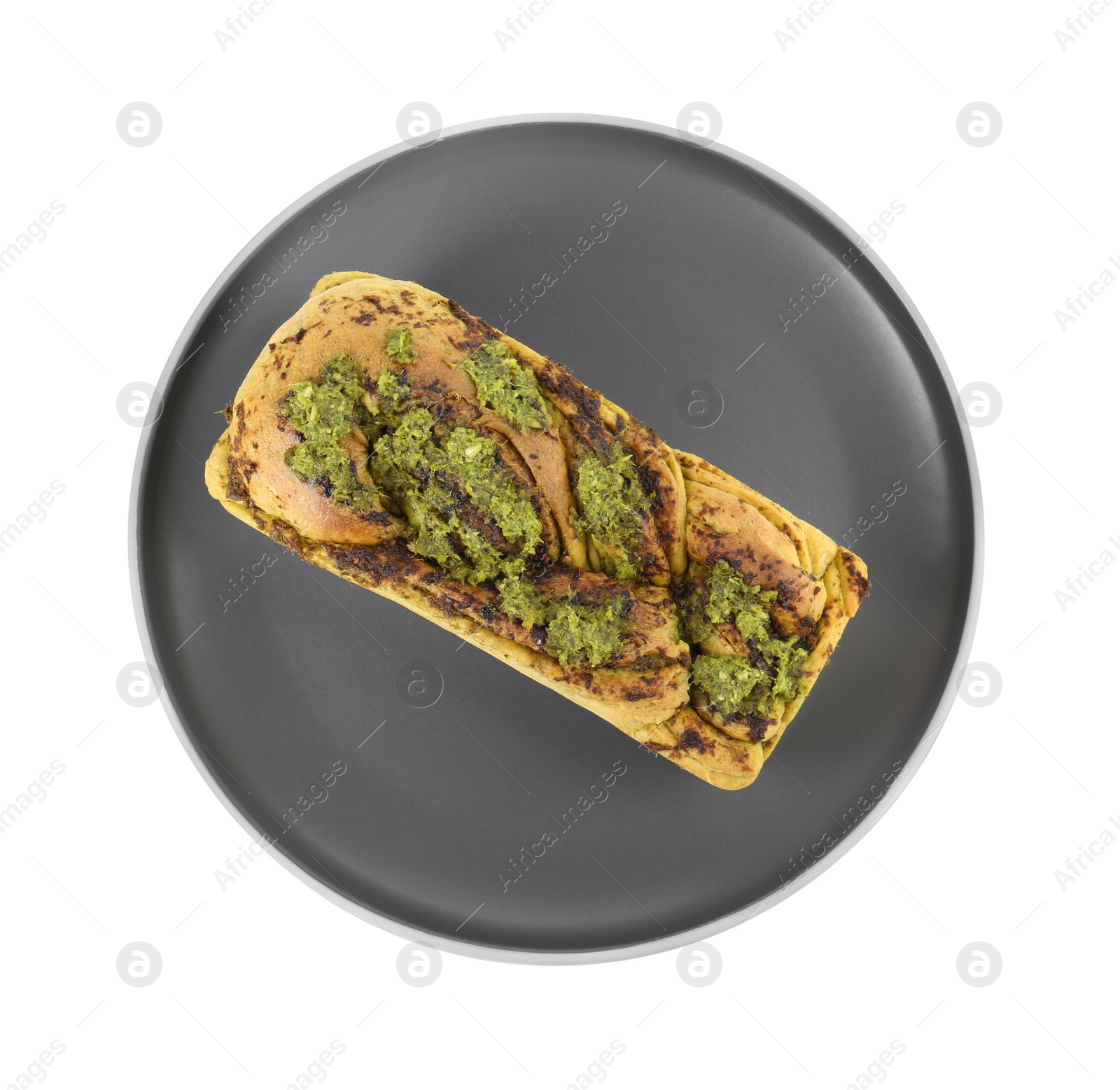 Photo of Plate with freshly baked pesto bread isolated on white, top view