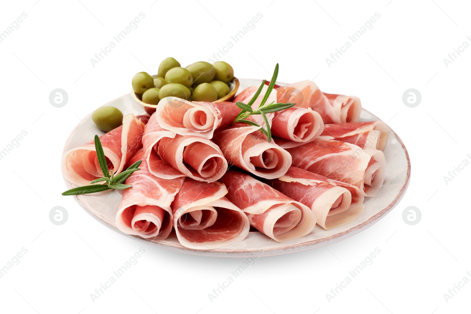 Photo of Plate with rolled slices of delicious jamon, olives and rosemary isolated on white