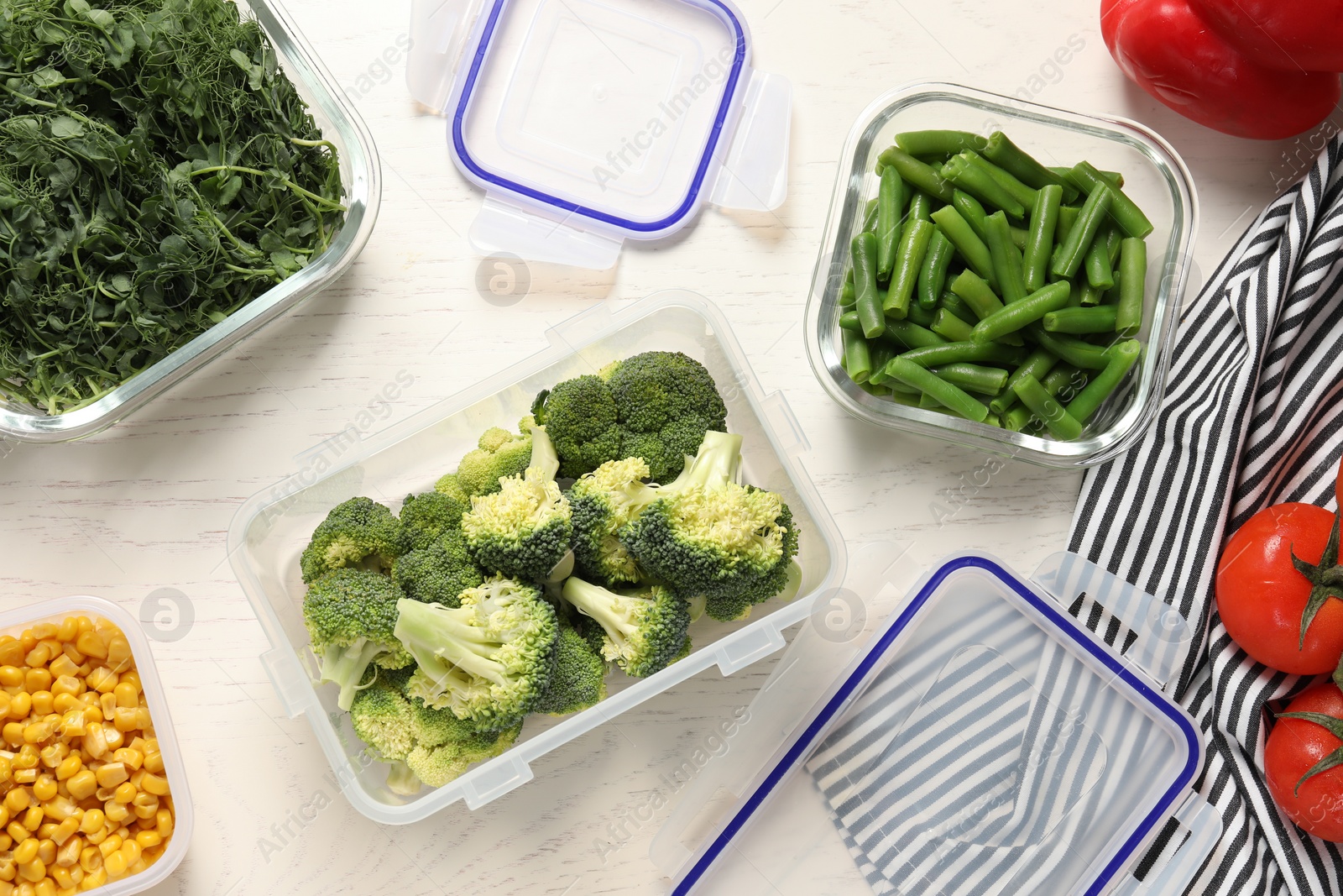 Photo of Containers with fresh products on white wooden table, flat lay. Food storage