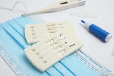 Photo of Disposable express test kit for hepatitis on white background