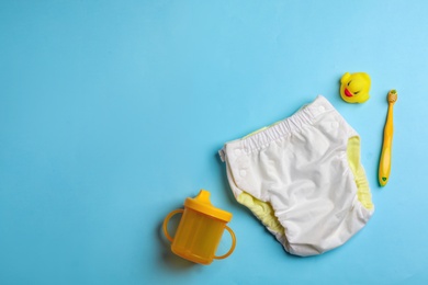 Photo of Flat lay composition with baby accessories on color background. Space for text