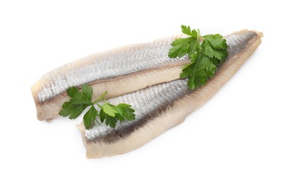 Photo of Delicious salted herring fillets with parsley on white background, top view