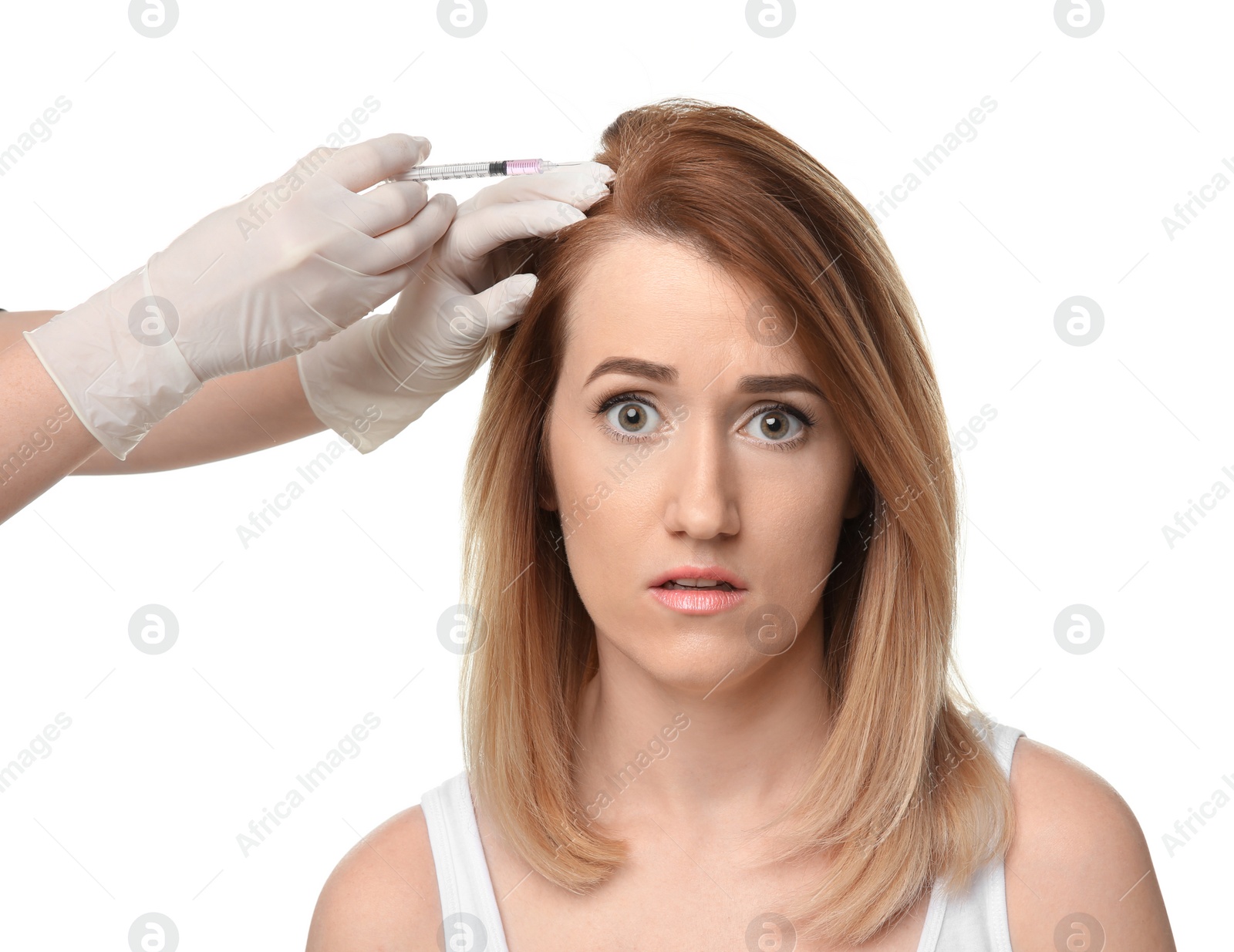 Photo of Young woman with hair loss problem receiving injection, on white background