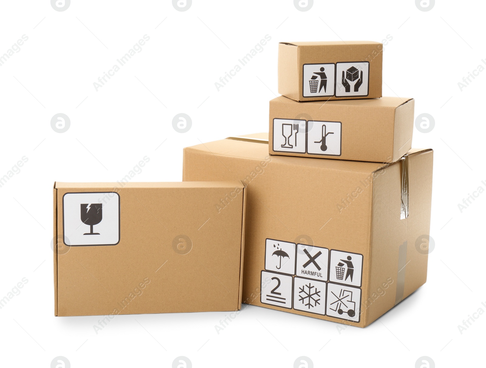 Photo of Cardboard boxes with different packaging symbols on white background. Parcel delivery