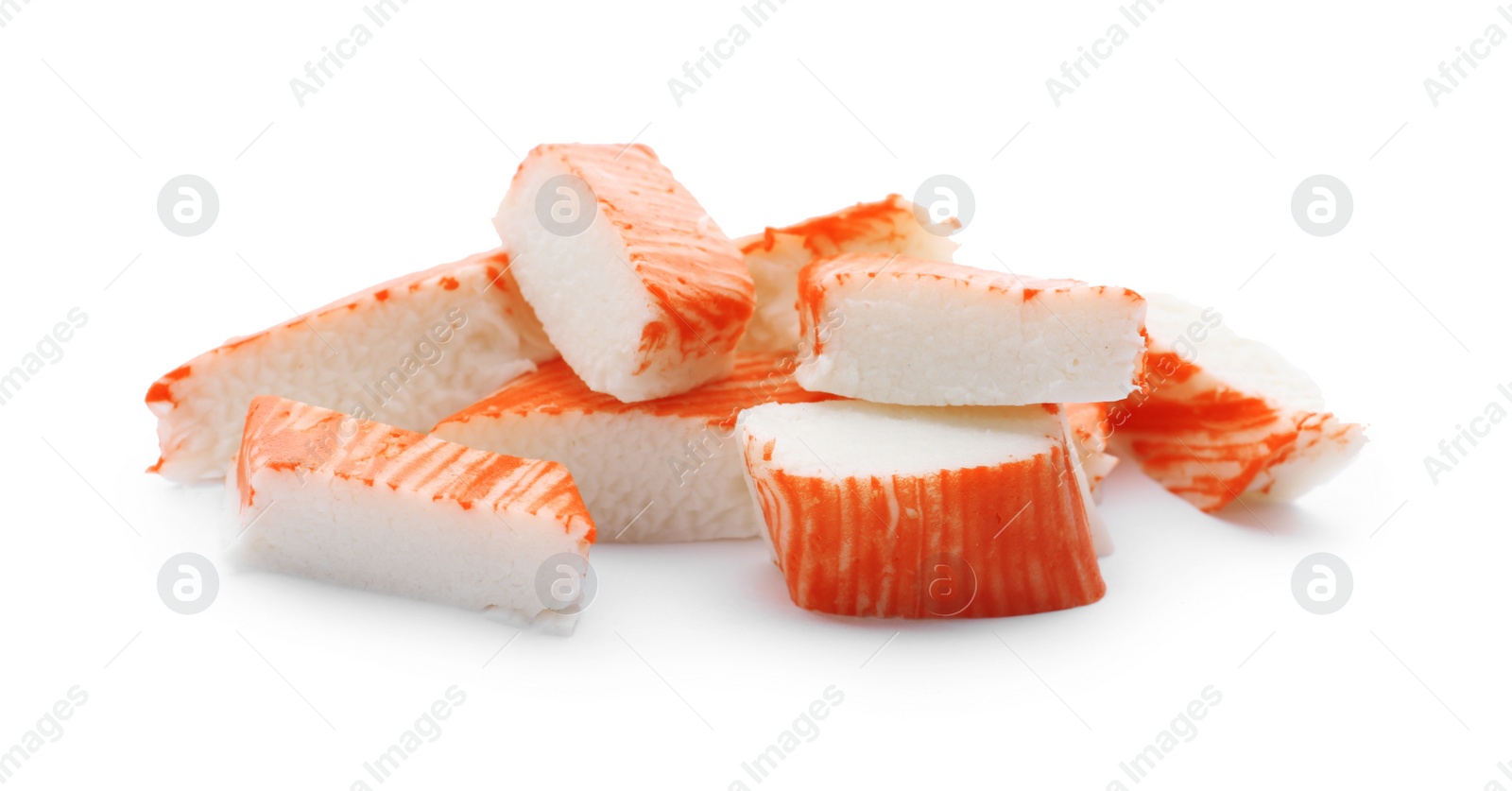 Photo of Pieces of crab sticks isolated on white