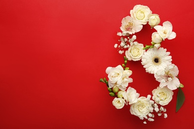 Photo of Number 8 made of beautiful white flowers on red background, flat lay with space for text. International Women's day