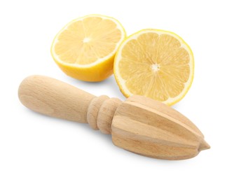 Wooden citrus reamer and fresh lemon on white background